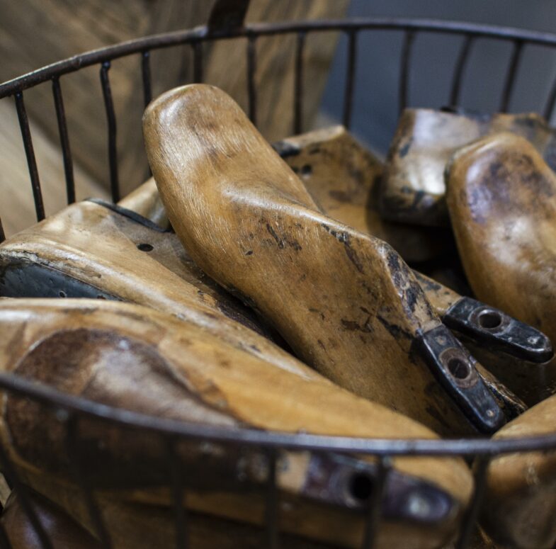Wooden footwear lasts in a basket