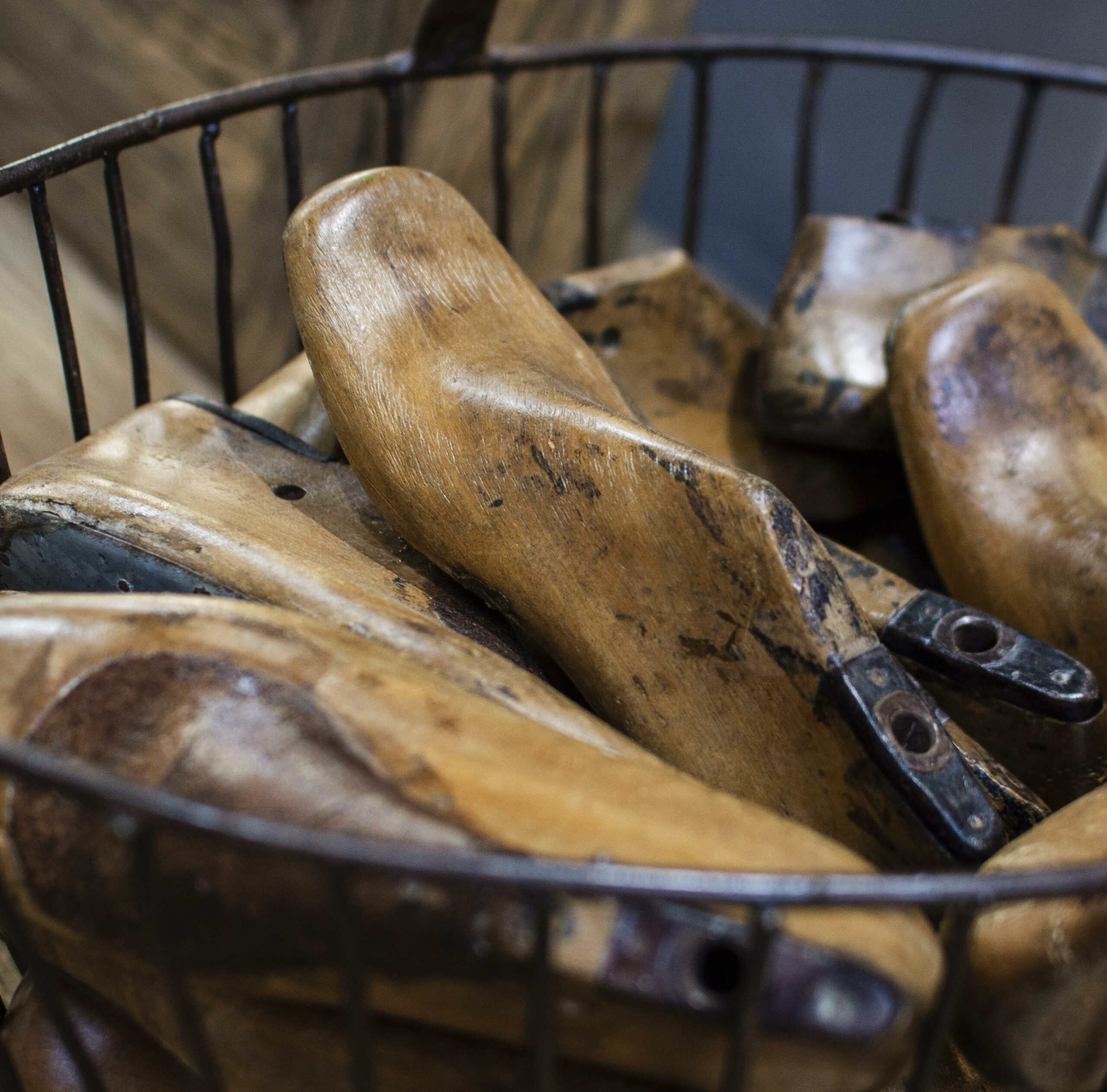 Wooden footwear lasts in a basket